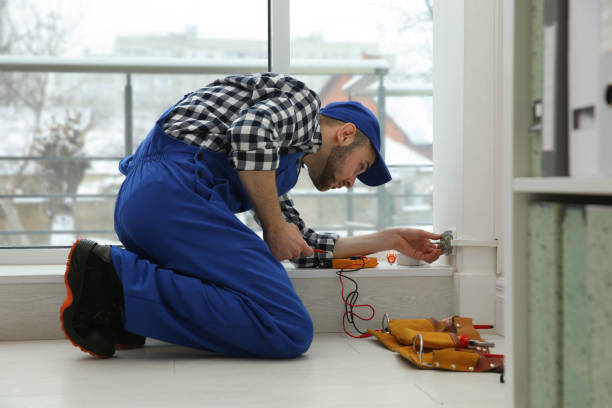 Electrician Fixing an outlet